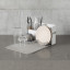 Umbra Sling Folding Dishrack - White in use on counter with dishes