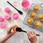 Tovolo Flex-Core Silicone Mini Spatula & Spoonula, Set of 2 - Black on the table with cupcakes