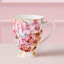 Maxwell & Williams Estelle Michaelides Enchantment Footed Mug, 300ml on the table