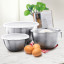 Tovolo Stainless Steel Mixing Bowls with Tight Seal Lids, Set of 3 on the kitchen counter with eggs