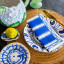 Tavola Stripe Biodegradable Paper Napkins, Pack of 25 blue on a plate