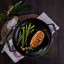 Victoria Enamelled Round Grill Cast Iron Skillet, 26cm with food on the table