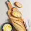 Legend Premium Beechwood Baguette Board with sliced bread