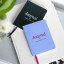 Printworks Pocket Notebook - Blue o the table with a black notebook