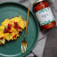 Razias Pickle  Medium Chilli Sauce, 375ml with food on the table
