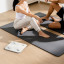 Eufy A1 Body Analysis Smart Scale - White next to a yoga mat