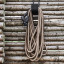 By Benson Deluxe Hose Set, 25m - Sand hanging on a wall