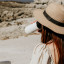 Kulgo Coffee Flask, 350ml - White in use on at a beach setting 
