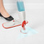 OXO Good Grips Microfiber Spray Mop with Slide-Out Scrubber being used on tiled floors 