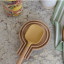 KitchenCraft Idilica Beechwood Spoon Rest with a spoon on the kitchen counter