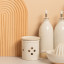KitchenCraft Idilica  Stoneware Garlic Storage Jar with a Grater Lid on the table