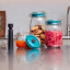 Airtender Vacuum Lid and Pump Set for Clip Top Jar on. the counter top with other jars