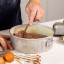 MasterClass Recycled Aluminium Springform Cake Tin, 20cm with cake dough