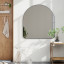 Umbra Hubba Arched Mirror - Metallic Titanium In A Living Room Setting 