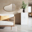 Umbra Hubba Pebble Mirror - Brass In A Living Room Setting 