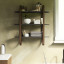 Umbra Bellwood Wall Shelf - Black & Walnut In A Bathroom Setting 