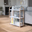 Umbra Bellwood 3-Tier Freestanding Shelf - White & Natural In A Living Room Setting  
