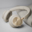 Bang & Olufsen Beoplay HX Headphones - Gold Tone on the table