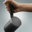 Bang & Olufsen Beosound Explore Outdoor Bluetooth Speaker - Black Anthracite showing scale in hand