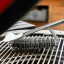 MasterClass BBQ Bristle Spiral Grill Brush on the grill rack