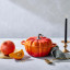 Le Creuset Signature Cast Iron Pumpkin Casserole, 24cm on the table