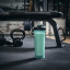 Contigo Shake & Go 2.0, 820ml - Bubble Tea next to a bench with weights