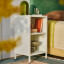 Popstrukt Wafer Side Table - Soft White next to the bed