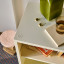 Popstrukt Wafer Side Table - Soft White with a glass of water