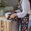 DSA Robyn Valerie Cosmos Full Bib Apron worn in the kitchen