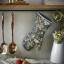 Ulster Weavers Finch and Flower Single Oven Glove hanging on a hook
