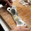 Tala Garlic Rocker and Herb Stripper in use with garlic