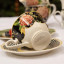 Jenna Clifford Botanica Rose Cup & Saucer on a table
