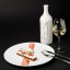 Gerard Bertrand Art De Vivre Clairette White Wine, 750ml next to plate of dessert