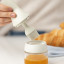Zuutii Oil Dispenser with Brush, 130ml - Light Cream on the table