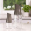 Zuutii Mini Oil Dispenser, 170ml - Dark Grey on the table with a 500ml oil dispenser
