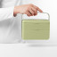 Blim Plus Bauletto Lunchbox, Medium - Forest Light held on the kitchen counter