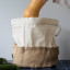 Pebbly Cotton Bag and Jute Storage Basket - Large on the table with butternut