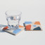 Alkaline Chunky Terrazzo Square Coasters, Set of 2 - Neutral detail with a glass of water