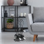 H & S Collection Black Metal Wine Rack next to a couch