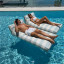 Sunnylife Luxe Lie-On Lounger Float - Lazy Days Blue Stripe floating in the pool
