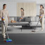 Dyson V15 Detect Submarine Cordless Vacuum Cleaner in use cleaning floor, couch and carpet
