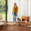 Dreame H12 Pro Vacuum Cleaner, 1400W cleaning a wooden floor under chair
