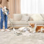 Dreame R10 Cordless Stick Vacuum Cleaner, 350W - Rose Gold cleaning up fluff from broken pillow