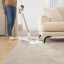 Dreame R10 Cordless Stick Vacuum Cleaner, 350W - Rose Gold cleaning up dirt from carpet 