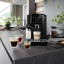 DeLonghi Magnifica Start with Milk Bean-to-Cup Coffee Machine on the kitchen counter with cups of coffee and tea