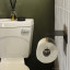 Joon Axle Toilet Paper Holder on a wall in the bathroom
