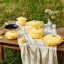 Le Creuset Chamomile Mini Stoneware Cocotte, 10cm on the table