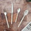 Nicolson Russell Louisiana Cutlery Set, 16-Piece - Ivory on the table