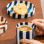Nicolson Russell Chelsea Striped Cup & Plate, Set of 2 - Blue with coffee on the table