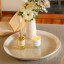 Amanda Jayne Wild Orchard Reed Diffuser, 170ml on the table with a candle